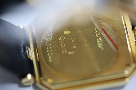 A ladys 18ct gold and diamond set Cartier quartz octagonal cased wrist watch, and Cartier box.